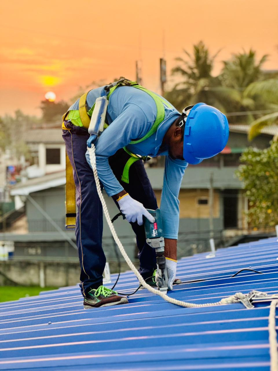 Technician installing and maintaining solar panels